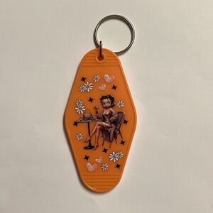 Orange Keychain with Cartoon Design